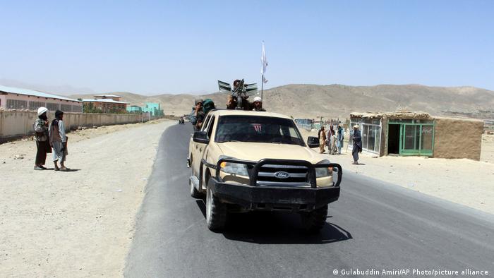 Taliban patrol Ghazni in a Ford truck.