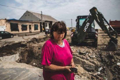 Vera Zhugarkova, 57, in the town of Hrusky, next to the crater where her house was, was badly damaged by the cyclone and had to be completely demolished