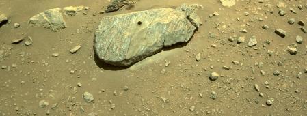 A hole in the rock on Mars after a sample was extracted