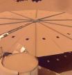 A solar panel covered in sand and dust from Mars