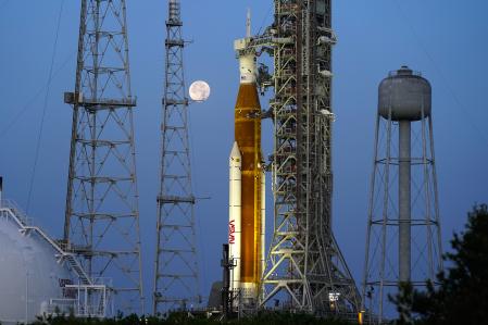 The SLS rocket and its destination, the Moon, June 15 in the launch tower at the Kennedy Space Center in Florida.