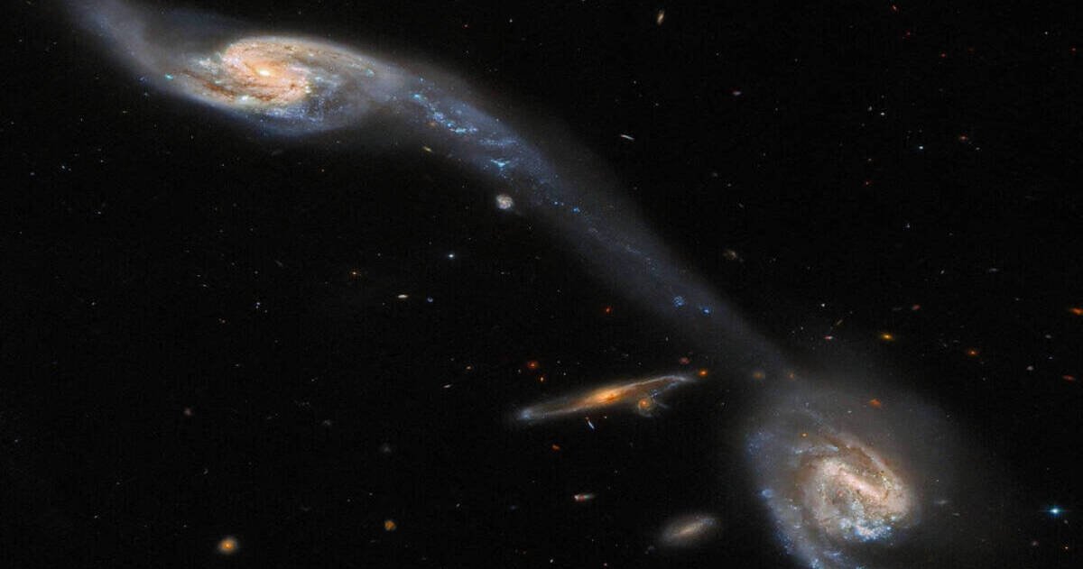 Intergalactic handshake: NASA's Hubble telescope creates a stunning cosmic bridge