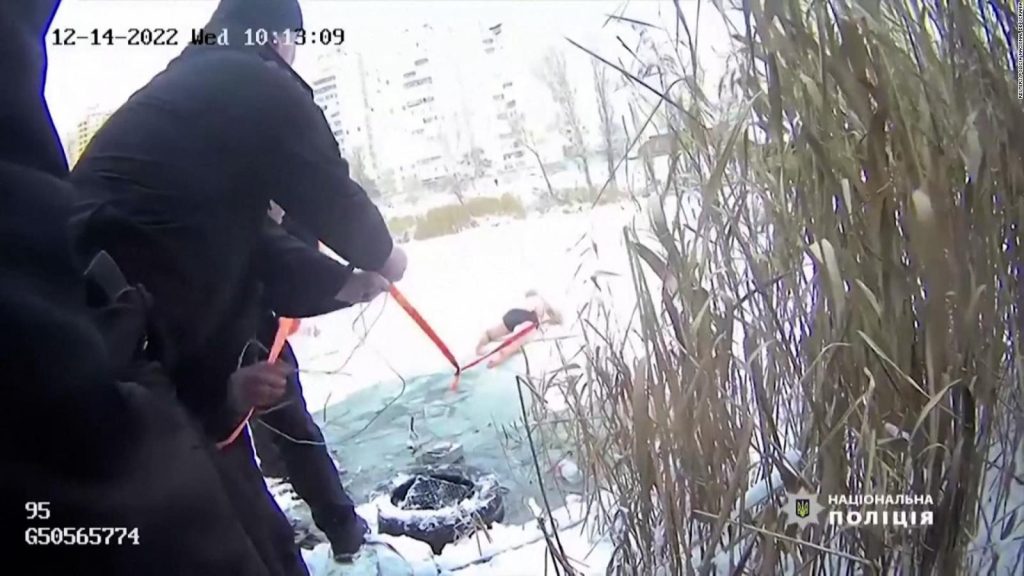 A woman and her dog have been rescued from a frozen lake