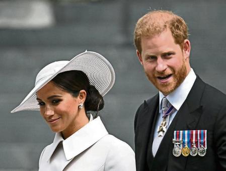 Britain's Prince Harry and his wife Meghan, Duchess of Sussex, leave after the National Thanksgiving Service held at St. Paul's Cathedral as part of celebrations marking the Platinum Jubilee of Britain's Queen Elizabeth, in London, Britain, June 3, 2022. REUTERS/Dylan Martinez