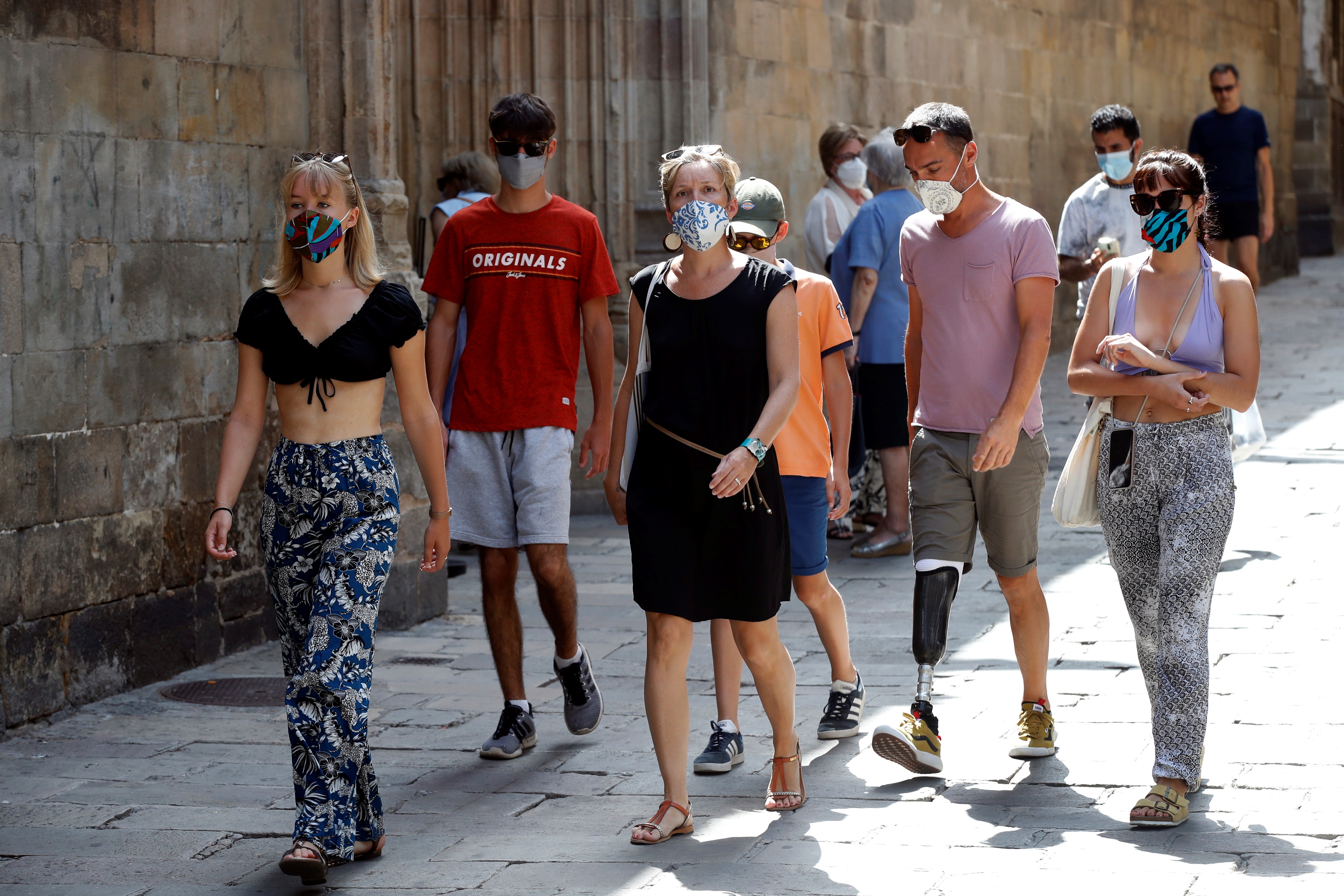 A group of tourists walk through Barcelona's Gothic Quarter.  EFE/Tony Albeer/File